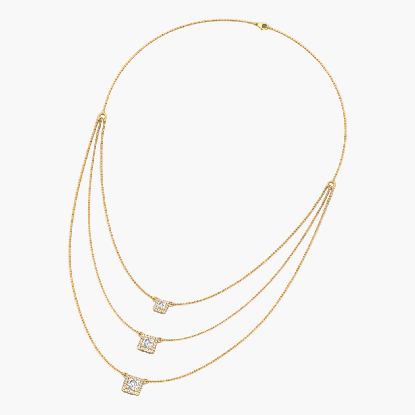 Gold necklace with square pendant on a white background