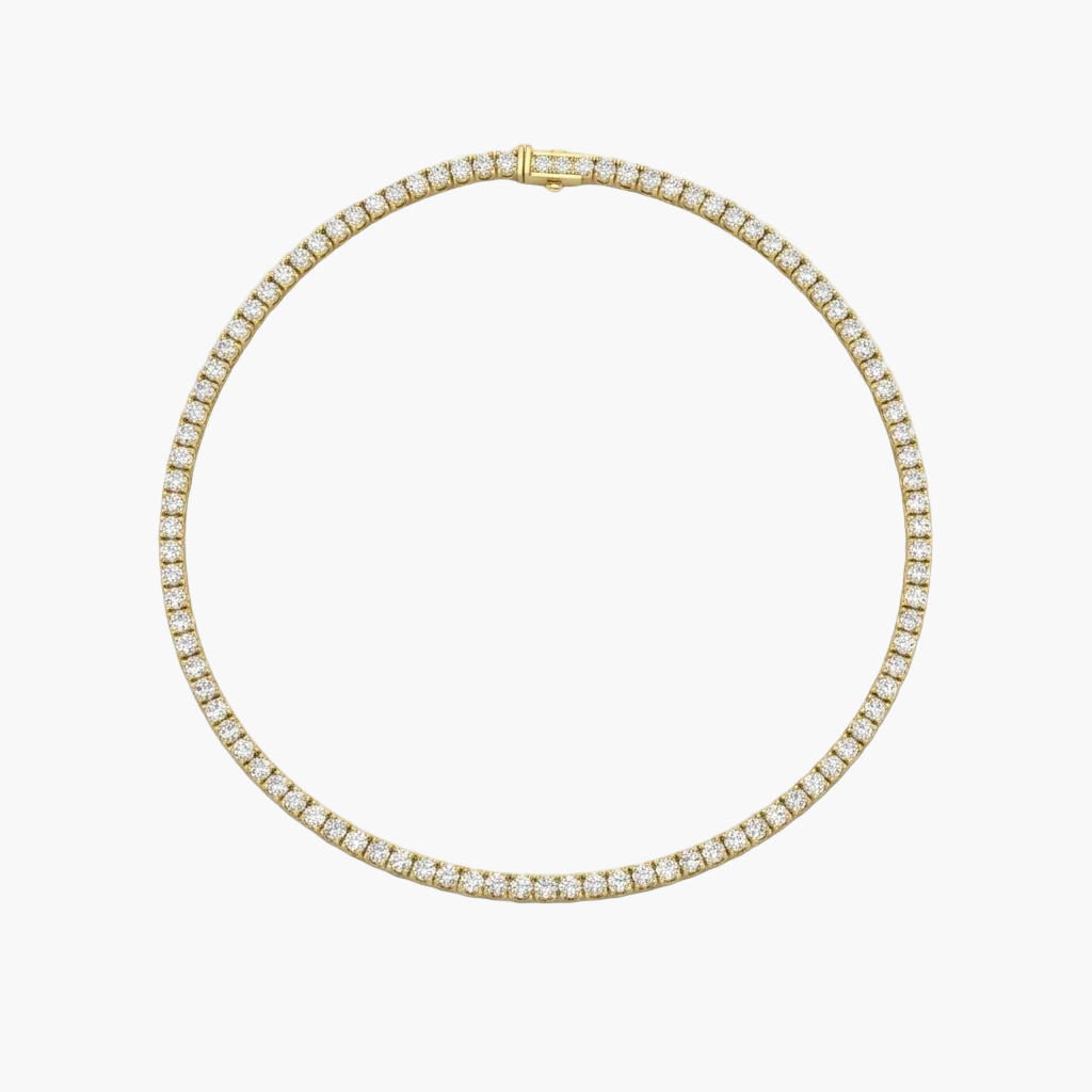 Gold necklace with diamond accents on a white background