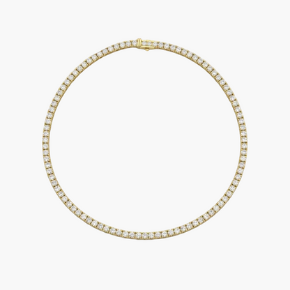 Gold necklace with diamond accents on a white background