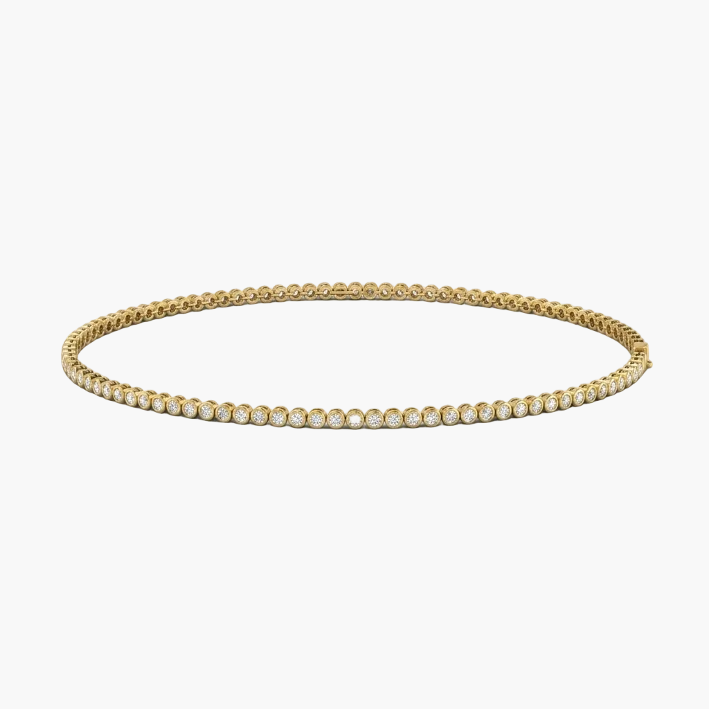 Gold necklace with clear gemstones on a white background