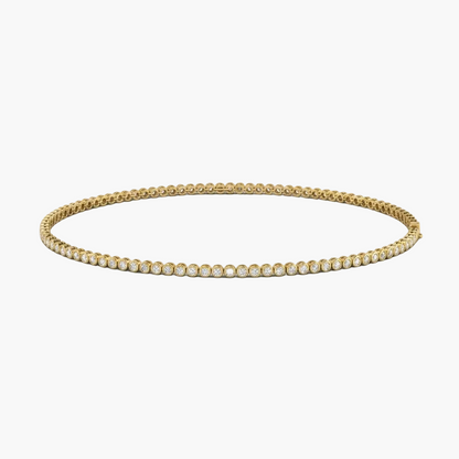 Gold necklace with clear gemstones on a white background