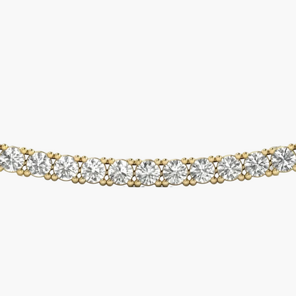 Gold necklace with clear gemstones on a white background