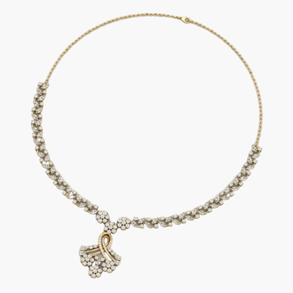 Gold necklace with a heart-shaped pendant on a white background