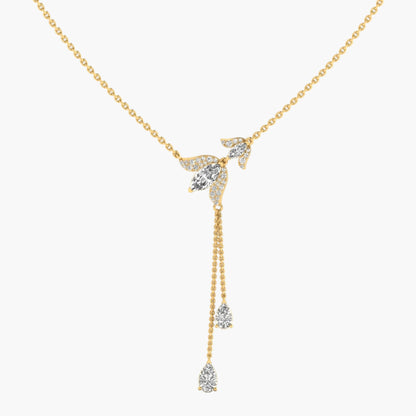 Gold necklace with diamond pendants on a white background
