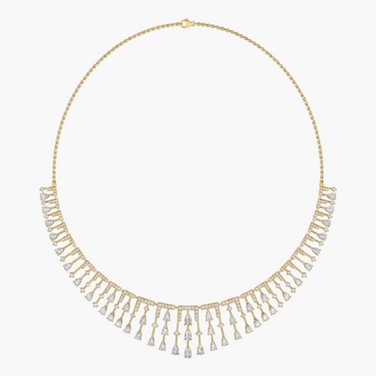 Gold necklace with diamond fringe on a white background