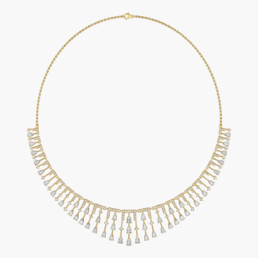 Gold necklace with diamond fringe on a white background