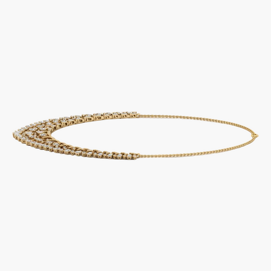Gold chain necklace on a white background