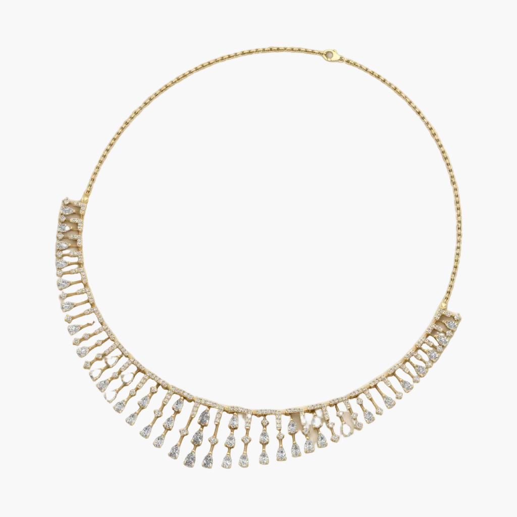 Gold necklace with clear stones on a white background