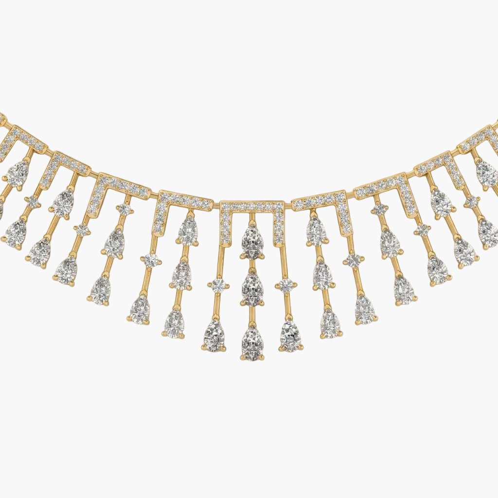 Gold and diamond fringe necklace on a white background
