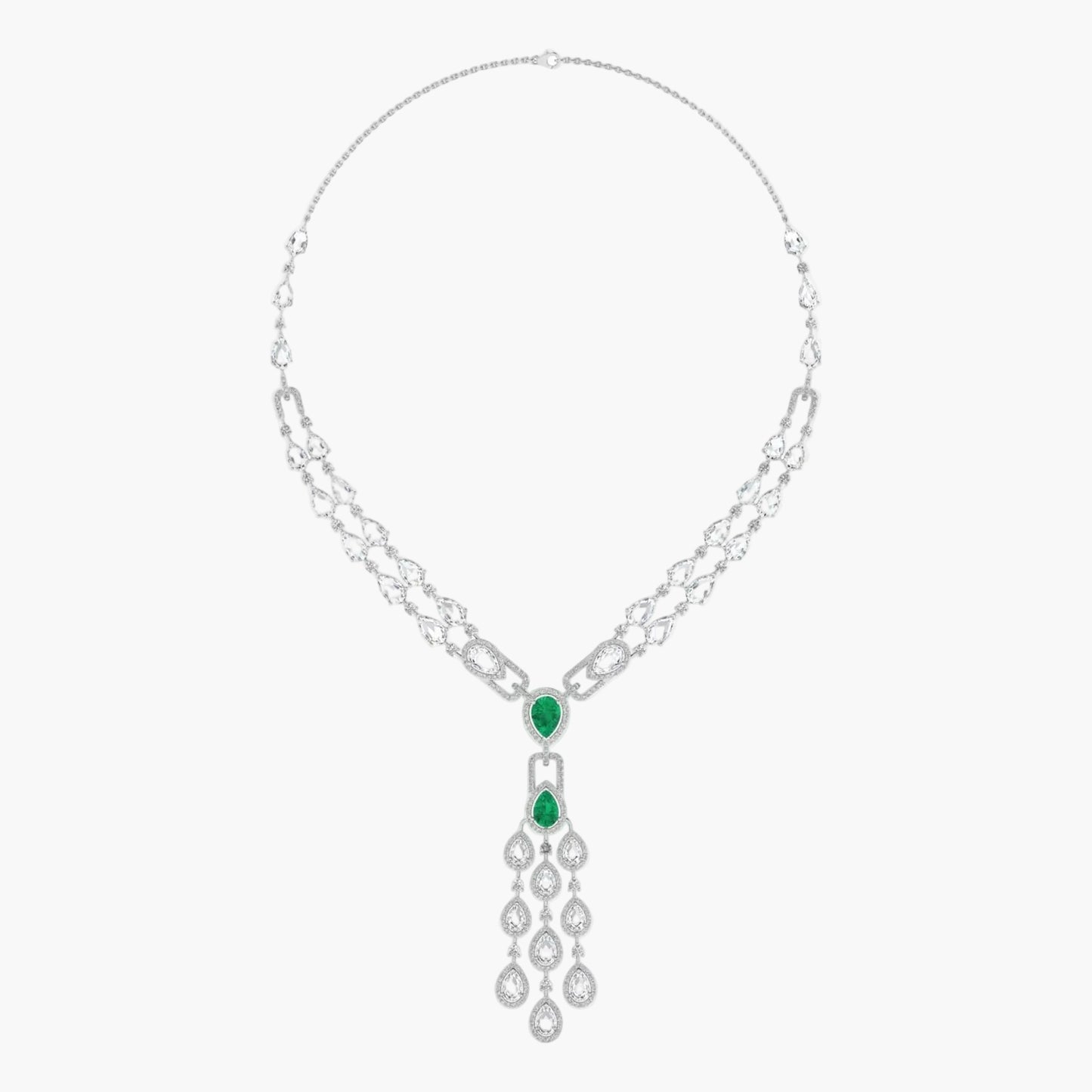 Silver necklace with emerald green gemstones on a white background