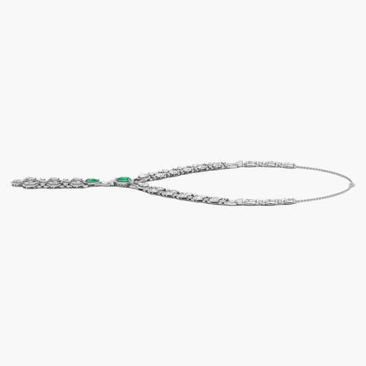 Silver necklace with green gemstones on a white background