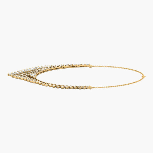 Gold necklace with green label on a white background