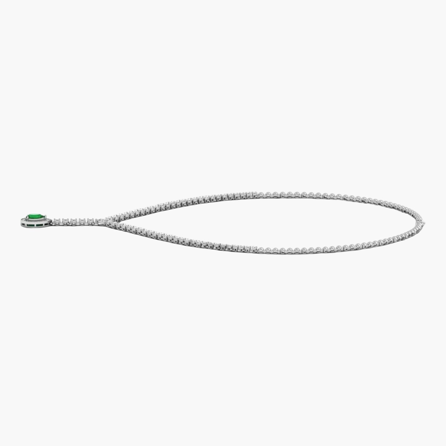 Silver necklace with a green gemstone on a white background
