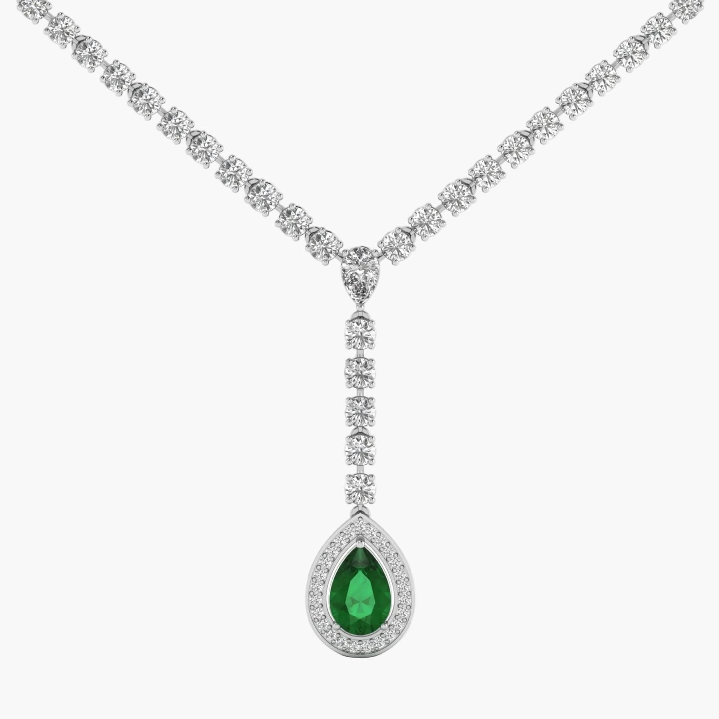 Diamond necklace with a green teardrop pendant on a white background