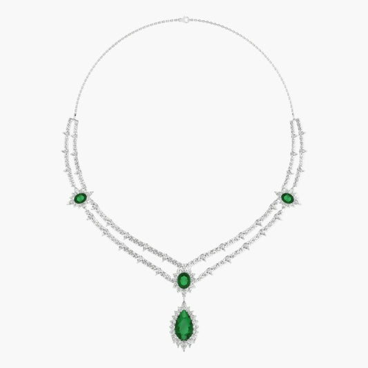 Elegant necklace with green gemstones on a white background