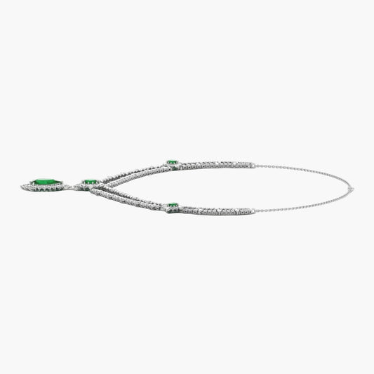 Silver necklace with green gemstones on a white background