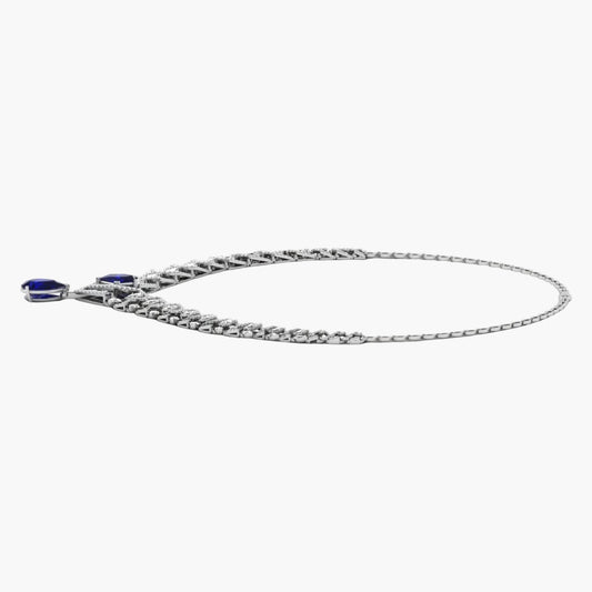 Silver bracelet with blue gemstones on a white background