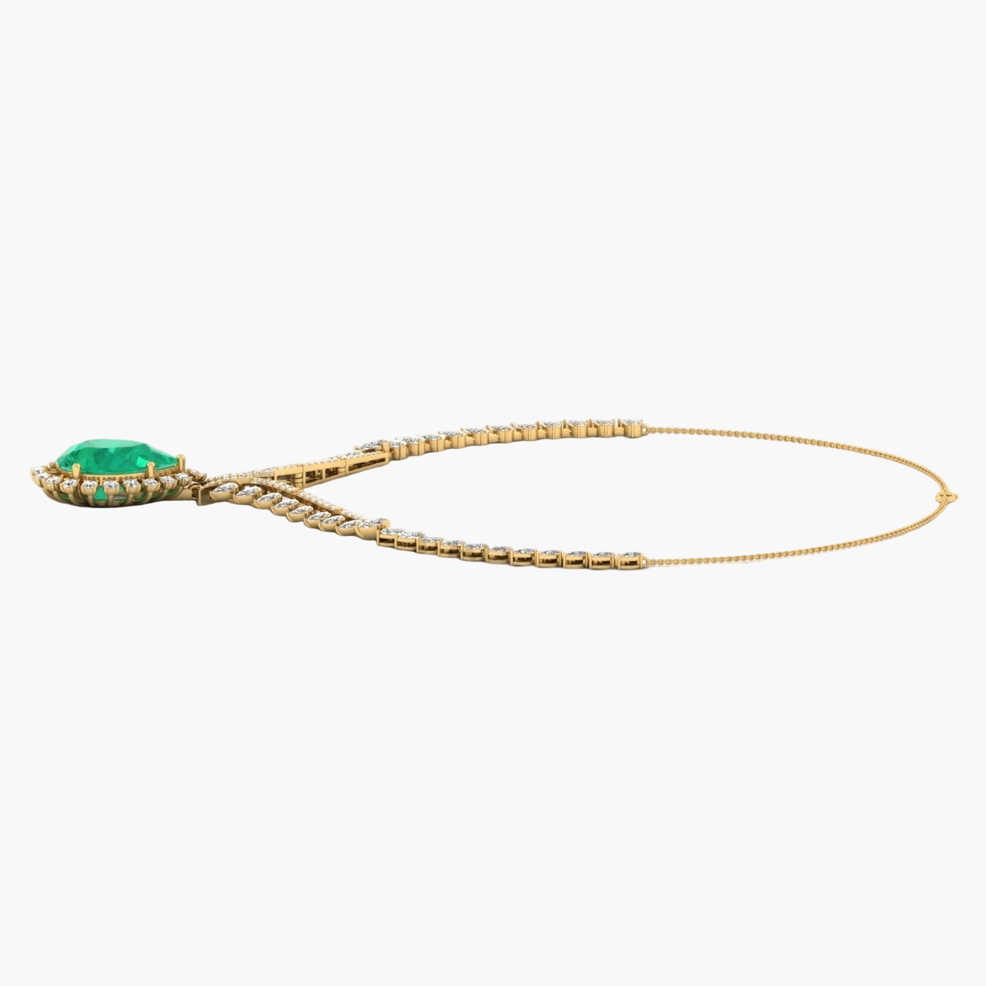 Gold necklace with a green gemstone on a white background