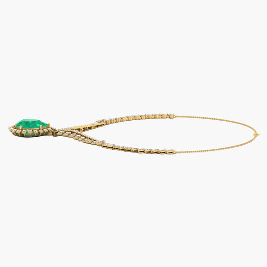 Gold necklace with a green gemstone on a white background