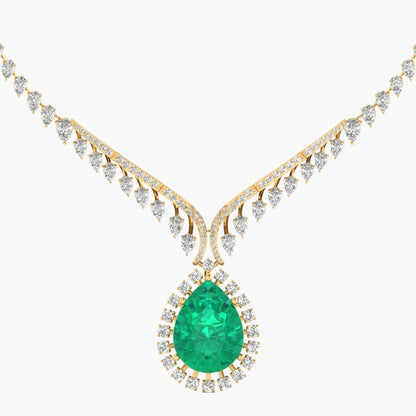 Gold necklace with a green emerald pendant on a white background