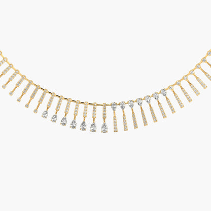 Gold necklace with diamond fringe on a white background