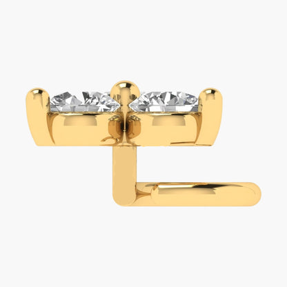Gold earring with clear gemstones on a white background
