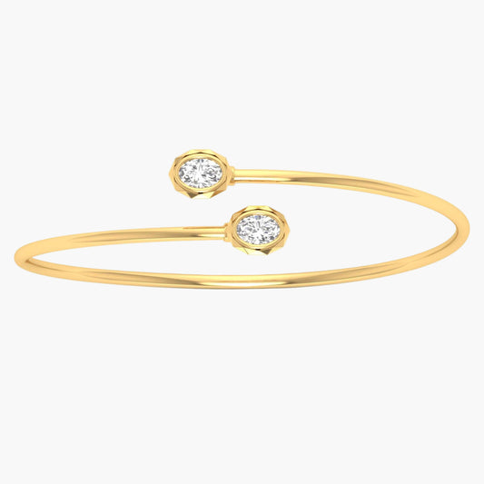 Gold bracelet with two diamond-like stones on a white background