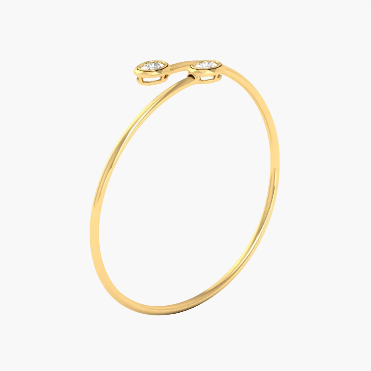 A gold open bangle bracelet with two small oval bezel-set clear gemstones at the top, shown on a plain white background with a faint GREEN LAB watermark.