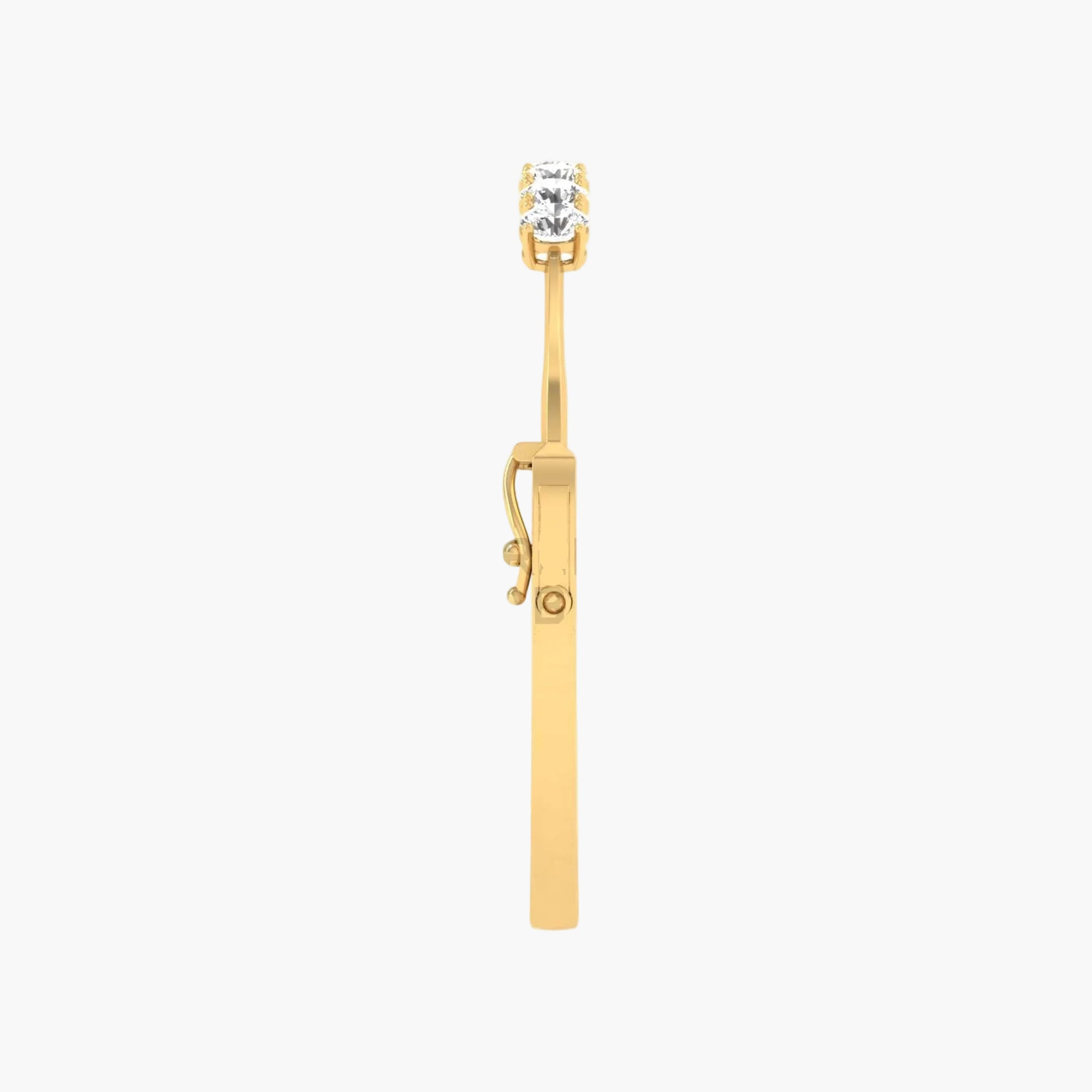 Gold earring with a clear gemstone on a white background