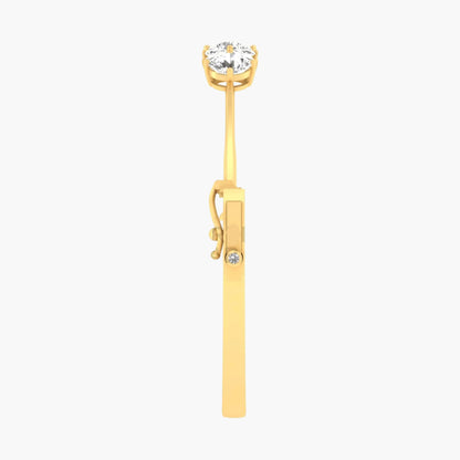 Gold earring with a clear gemstone on a white background