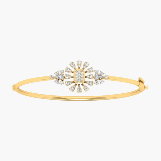 A yellow gold bangle bracelet featuring a central sunburst motif paved with clear stones, set against a plain white background.