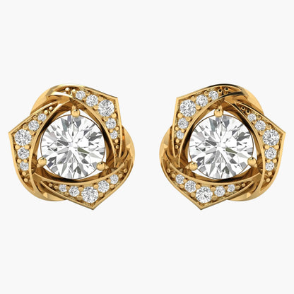 Gold earrings with large central gemstones and smaller diamonds on a white background