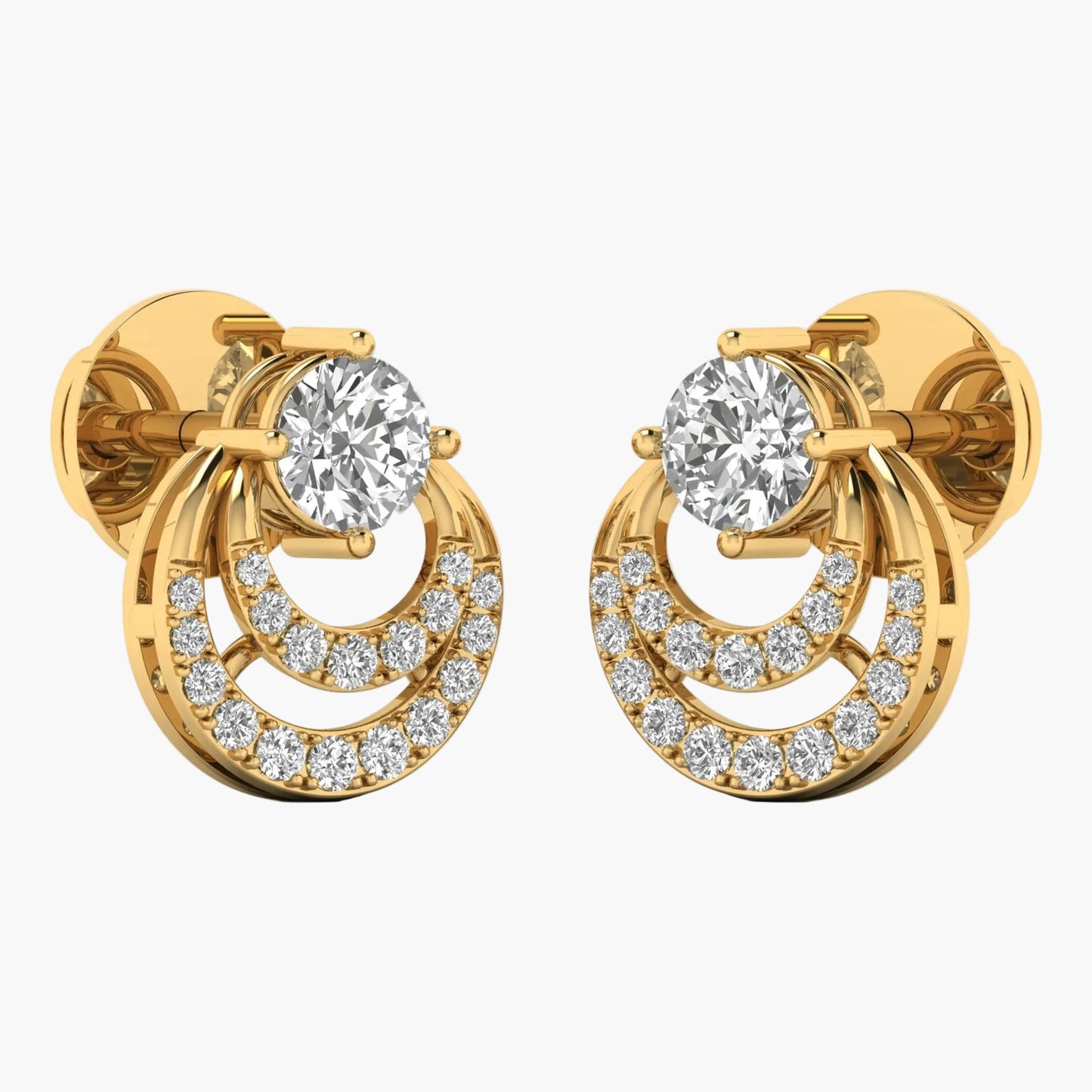 Gold earrings with clear gemstones on a white background