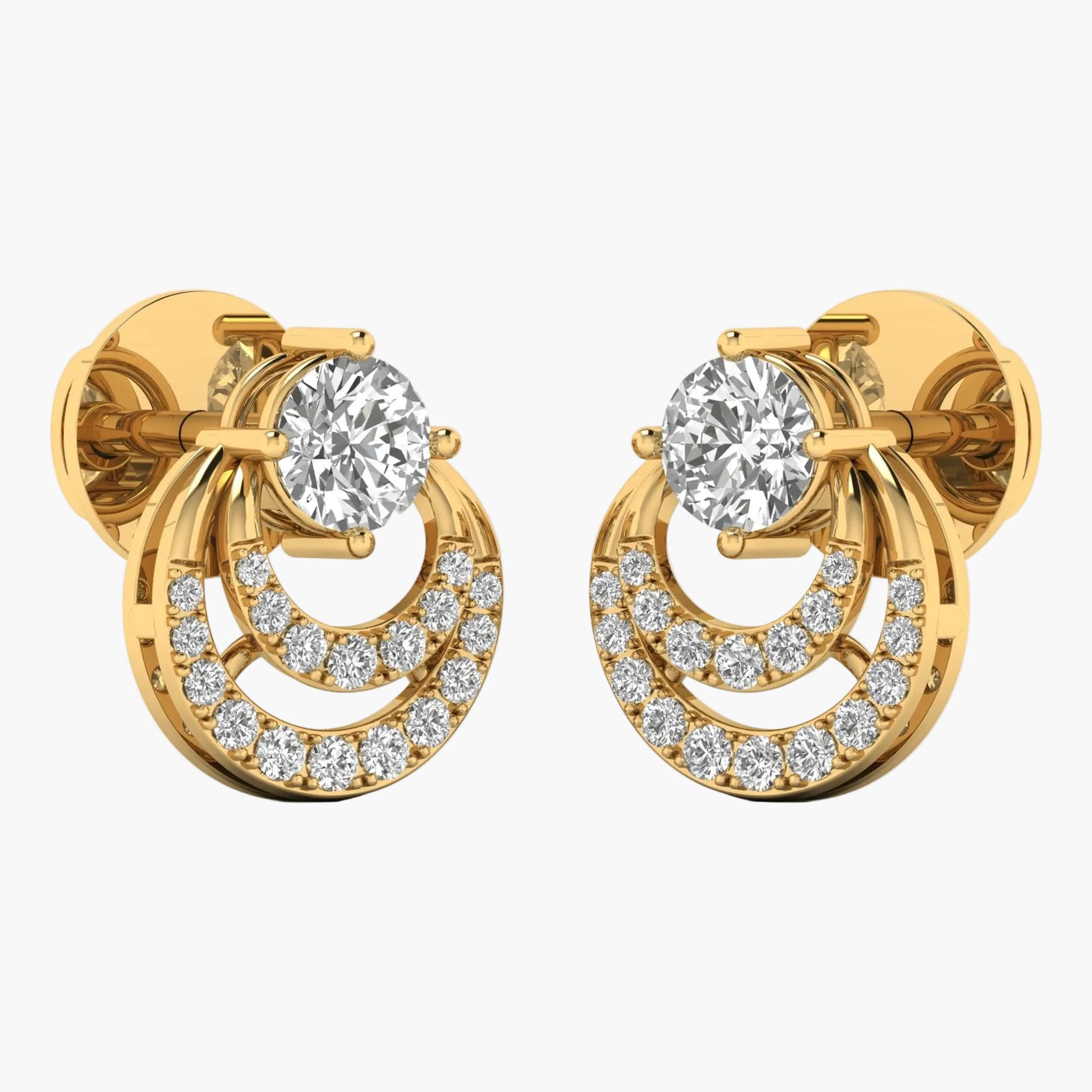 Gold earrings with clear gemstones on a white background