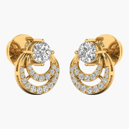 Gold earrings with clear gemstones on a white background