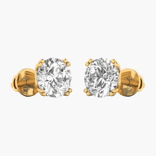 A pair of yellow gold stud earrings with oval-cut clear gemstones in a prong setting, shown against a plain white background with a faint watermark across the center.