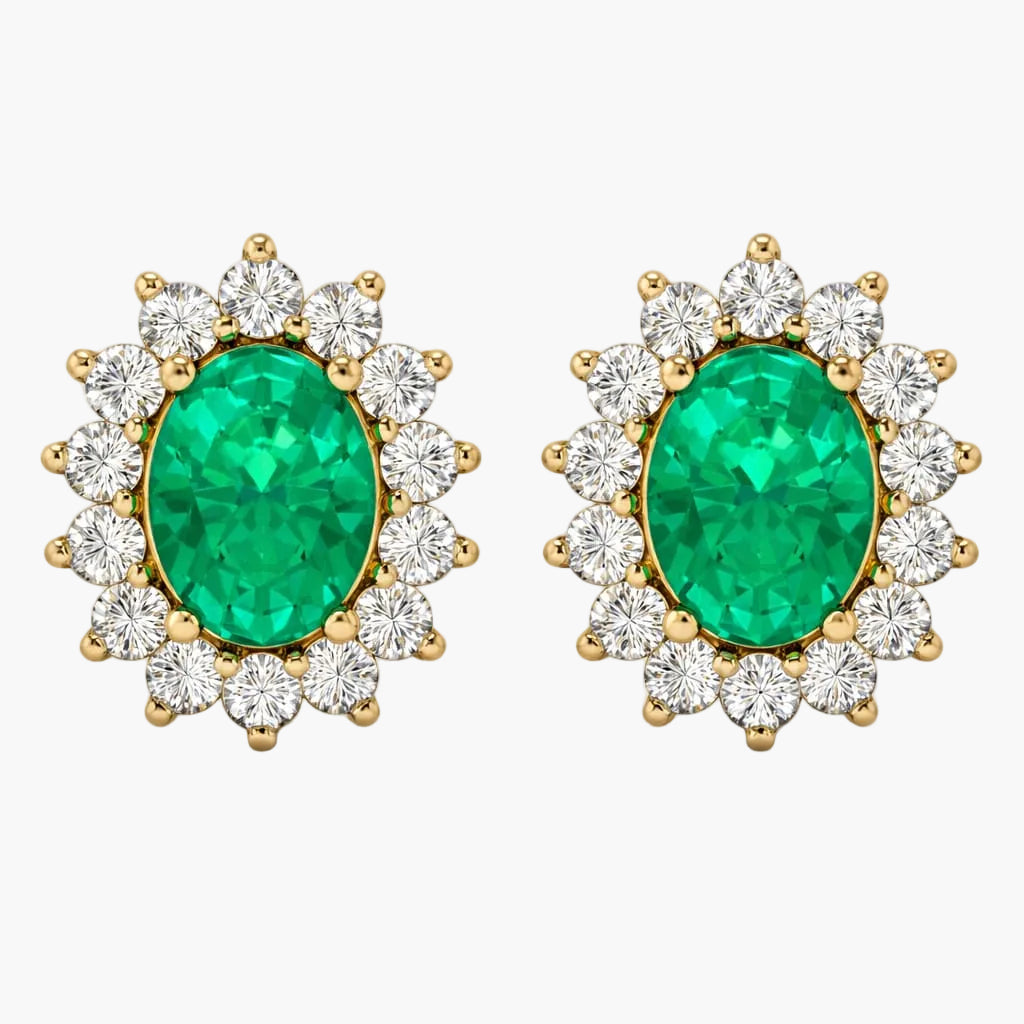Pair of emerald and diamond earrings on a white background