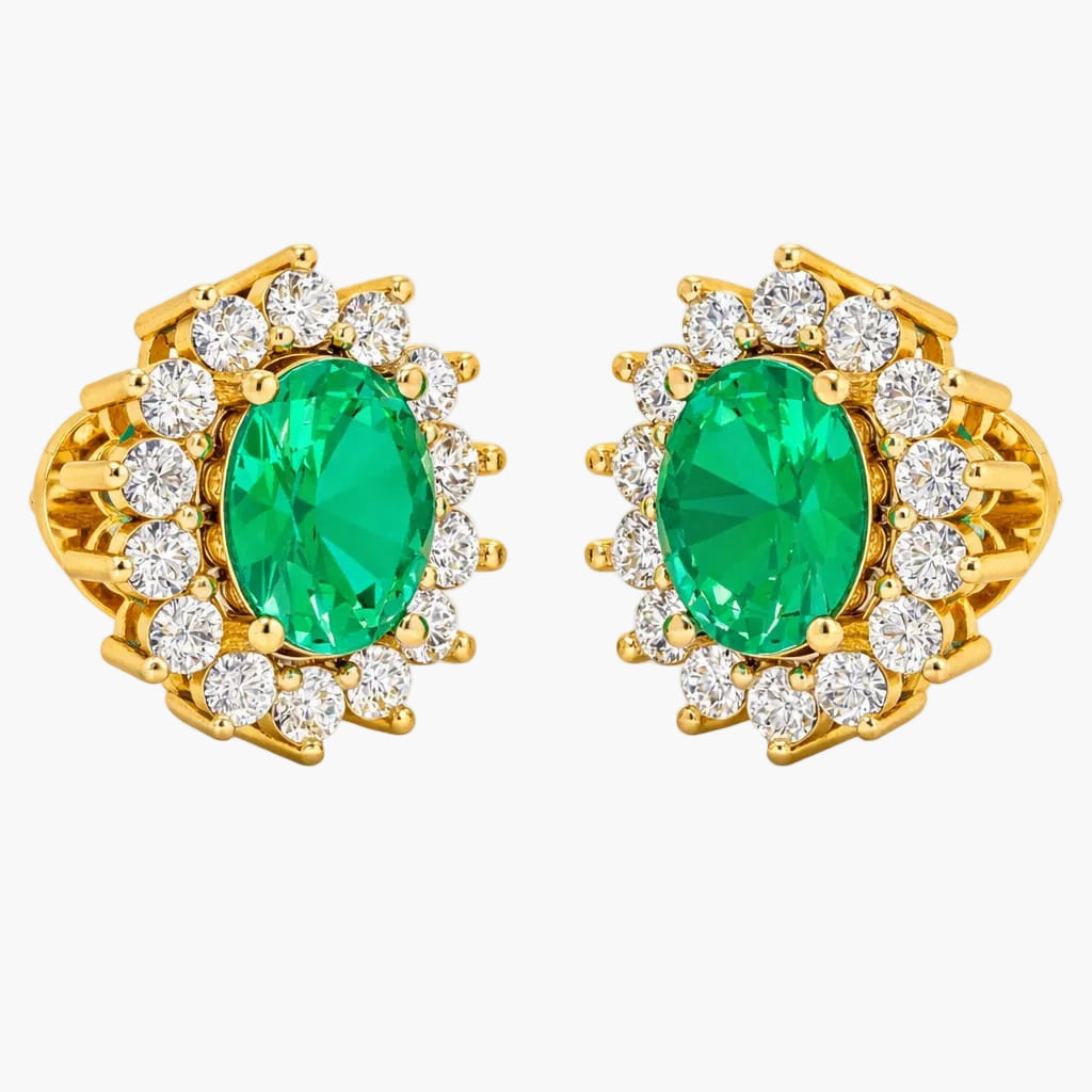 Gold earrings with green gemstones and clear stones on a white background