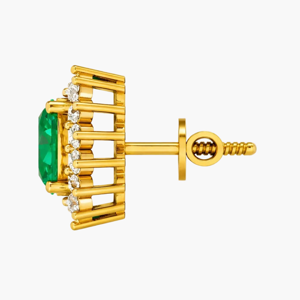 Gold earring with green gemstone and diamonds on a white background