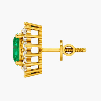 Gold earring with green gemstone and diamonds on a white background