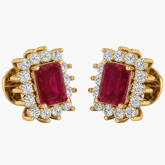 Pair of gold earrings with red gemstones and diamond accents on a white background