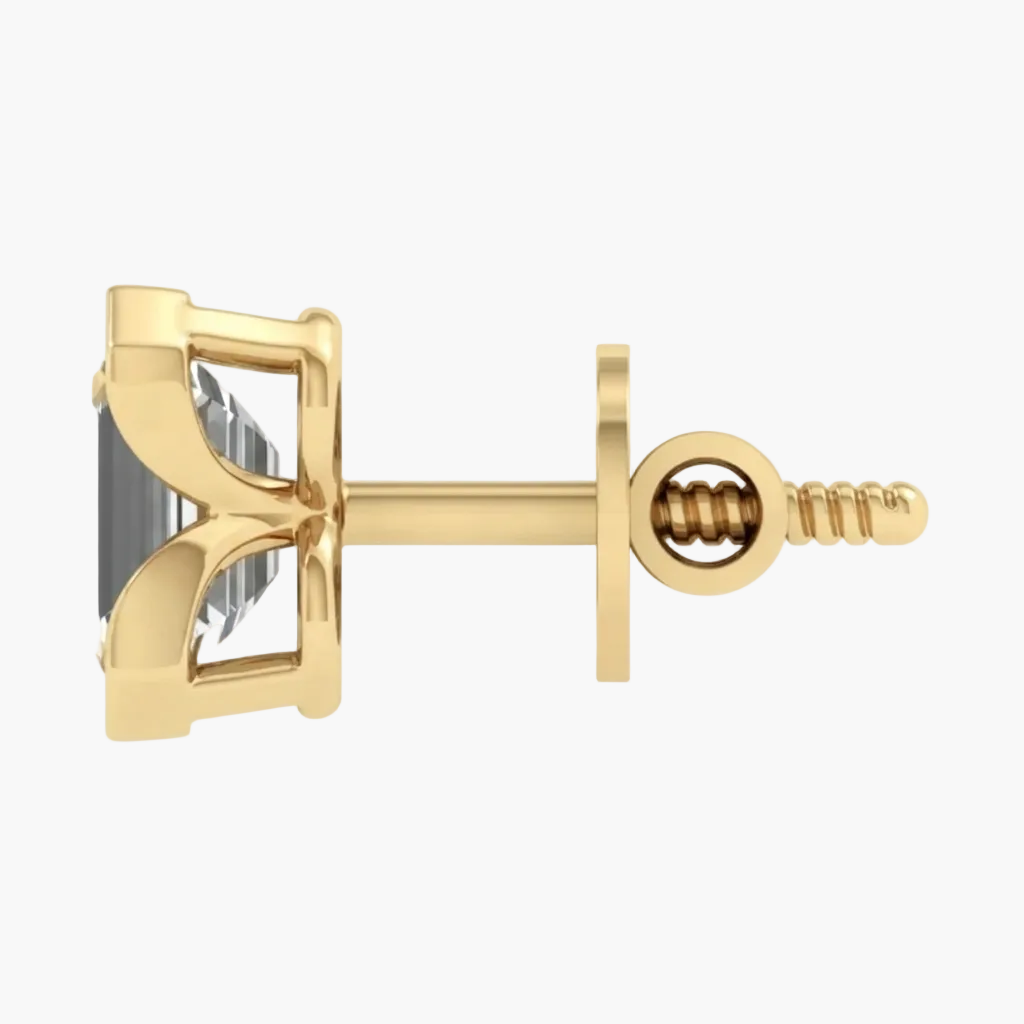 A single gold stud earring with a clear rectangular gemstone, shown from the side on a plain white background.
