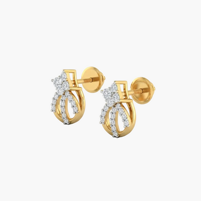 A pair of gold huggie hoop earrings with a bow design, embellished with small clear cubic zirconia stones, shown on a clean white background.