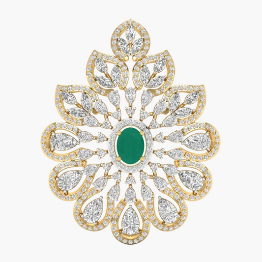 An ornate floral brooch featuring a central oval green emerald stone surrounded by a halo of small clear stones, with multiple layered petal-like shapes in yellow gold and diamond settings on a white background.
