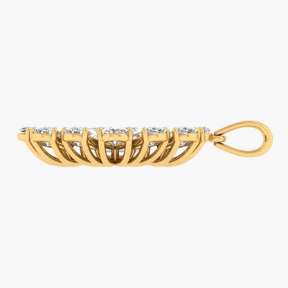 A gold pendant featuring a curved row of small clear gemstones in a prong setting, suspended over a matching gold openwork filigree base with a loop at the end, shown on a plain white background.