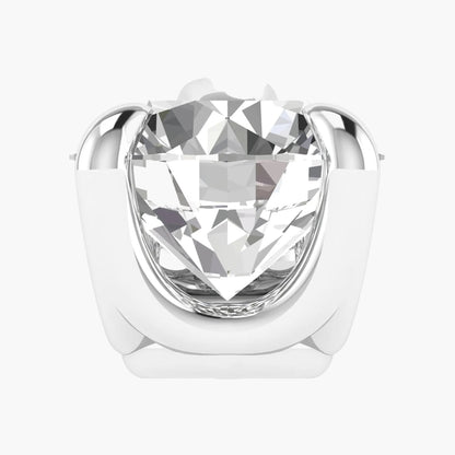 Silver ring with a large clear gemstone on a white background