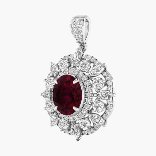 Diamond pendant with a red gemstone on a white background