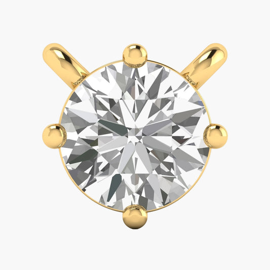 Gold pendant with a large diamond on a white background