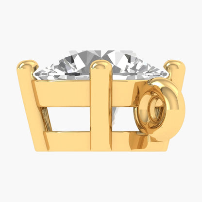 Gold ring with a large diamond on a white background