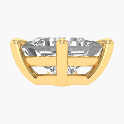 Gold ring with a large clear gemstone on a white background